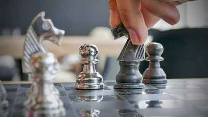 Hand of chess player moving the checkmate