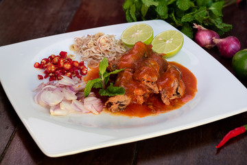 Spicy fish Canned Sardines Salad on wood background