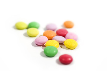 Colorful candy macro focus and blur back ground on white paper. 