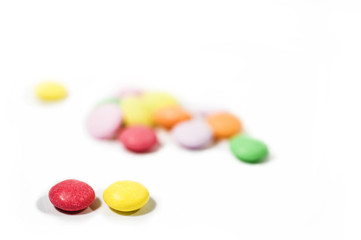 Colorful candy macro focus and blur back ground on white paper. 