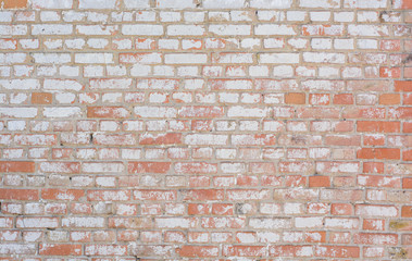 wall of red bricks in whitewashing