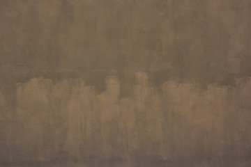 A wall with khaki stains