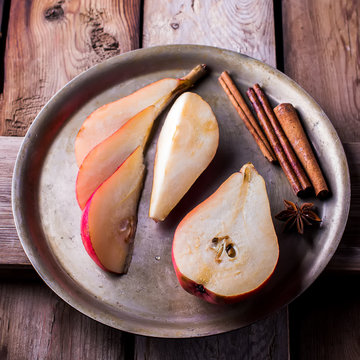 Red pears in metal bowl