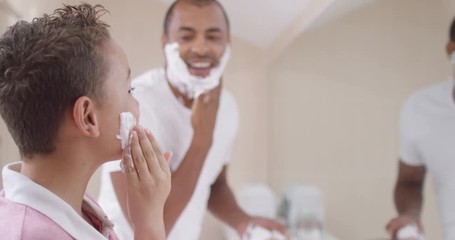 Happy smiling father and son spending time together and shaving - Powered by Adobe