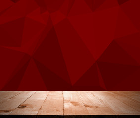 Wooden deck table over red polygon wall. Ready for product monta - obrazy, fototapety, plakaty