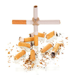 The composition in the form of  cross, and smoked cigarette isolated on white 