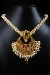 Indian Traditional Gold Necklace with Pearl © SBM Creatives
