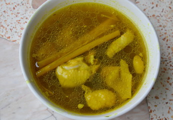 chicken boiled with turmeric spicy soup in cup