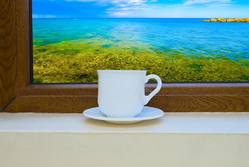 cup of coffee on the window