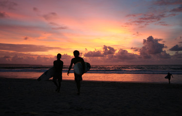 Sunset surfers in Kuta (Bali, Indonesia)