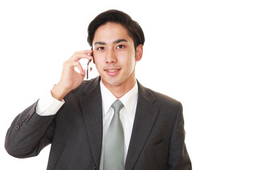 通話中の笑顔のビジネスマン