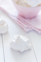 Meringue plate at white wooden background 