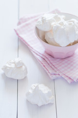 Meringue plate at white wooden background 