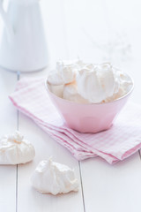 Meringue plate at white wooden background 
