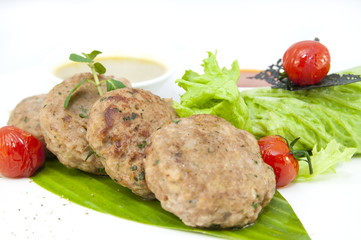 vegetarian meatballs with salad on a white background in restaurant
