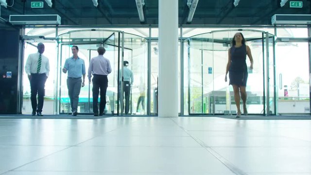 Time lapse of business team in lobby area of modern office building