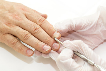 the process of the male manicure in a beauty salon