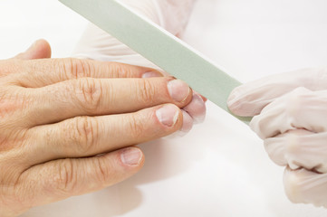 the process of the male manicure in a beauty salon