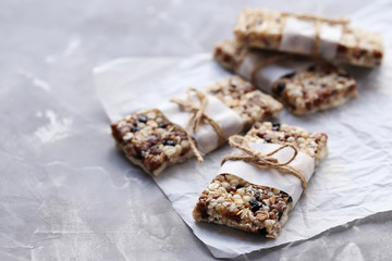 Granola bar on a grey table, close up