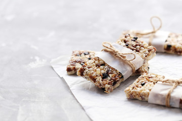Granola bar on a grey table, close up