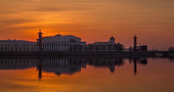 Russia, Saint-Petersburg, 28 March 2016: Timelapse of water area of Neva River at sunset, water mirror, reflections, Birzhevoy, Dvorcovy, Palace bridge, Stock Exchange Building, Rastralnye columns