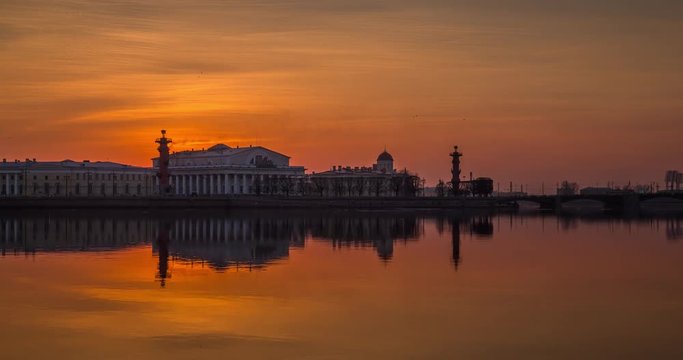 Russia, Saint-Petersburg, 28 March 2016: Timelapse of water area of Neva River at sunset, water mirror, reflections, Birzhevoy, Dvorcovy, Palace bridge, Stock Exchange Building, Rastralnye columns