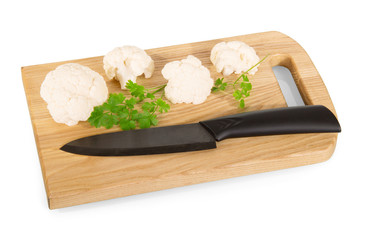 Sliced Cauliflower, board and knife isolated on white 