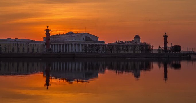 Russia, Saint-Petersburg, 28 March 2016: Timelapse of water area of Neva River at sunset, water mirror, reflections, Birzhevoy, Dvorcovy, Palace bridge, Stock Exchange Building, Rastralnye columns