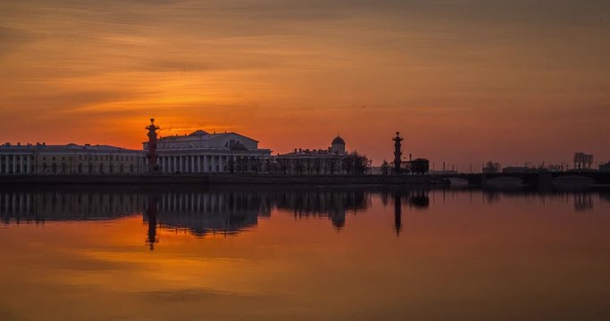 Russia, Saint-Petersburg, 28 March 2016: Timelapse of water area of Neva River at sunset, water mirror, reflections, Birzhevoy, Dvorcovy, Palace bridge, Stock Exchange Building, Rastralnye columns