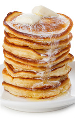 Stack of delicious pancakes with butter on plate isolated on white background.