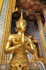 Sawasdee or hello in Thai Language. Close-up golden statue of Kinara at Wat Phra Kaew in Grand Place Complex in Bangkok, Thailand