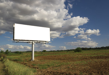 Billboard - Empty billboard in front of beautiful cloudy sky in a rural location