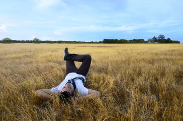 Young asian man relaxing on savanna