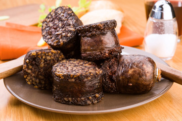 pieces of fried sausage in earthenware