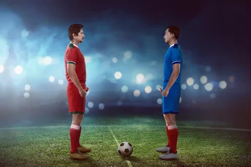 Gordijnen Two football player facing each other © Leo Lintang
