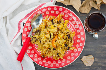 Vegetarian risotto with quince and dried fruits, top view, horizontal
