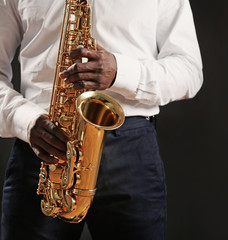 African American jazz musician playing the saxophone, closeup