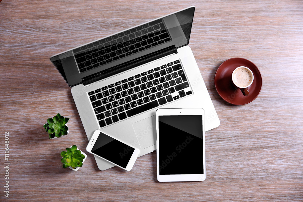 Canvas Prints Modern laptop, smart phone and tablet with coffee cup on a wooden table