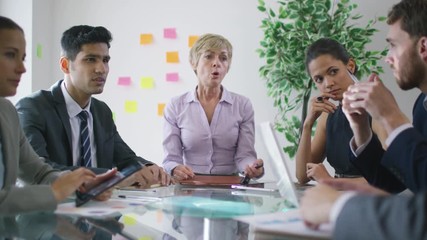  Stress in the workplace - corporate business team argue over poor performance