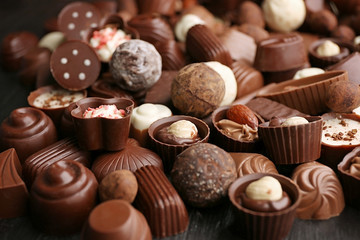 Obraz na płótnie Canvas Assortment of delicious chocolate candies background, close up