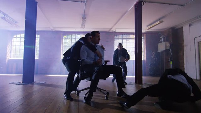 Handsome special agent character escapes interrogation by Asian criminal gang