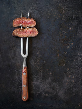 Steak on meat fork