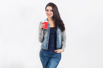  woman on white wall with takeaway coffee