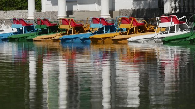 Row of catamarans on the lake