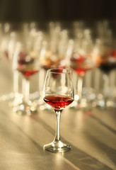Glass of red wine on a table, close up