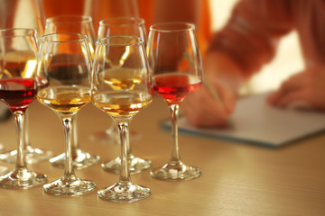 Experts tasting new sorts of wine at the table