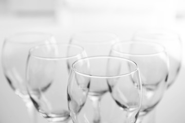 Wineglasses on blurred interior background