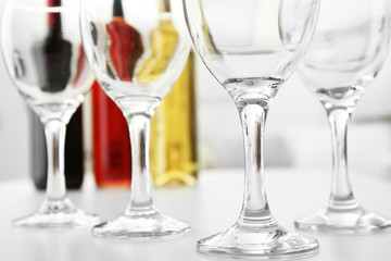 Wineglasses on blurred interior background