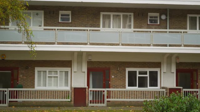  Exterior view of London block of flats built around a central courtyard
