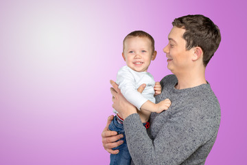 .Happy father holding his little son.